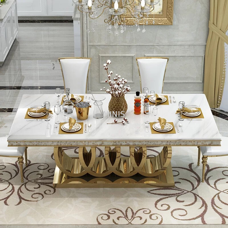 Mesa de comedor rectangular moderna de mármol dorado con sillas